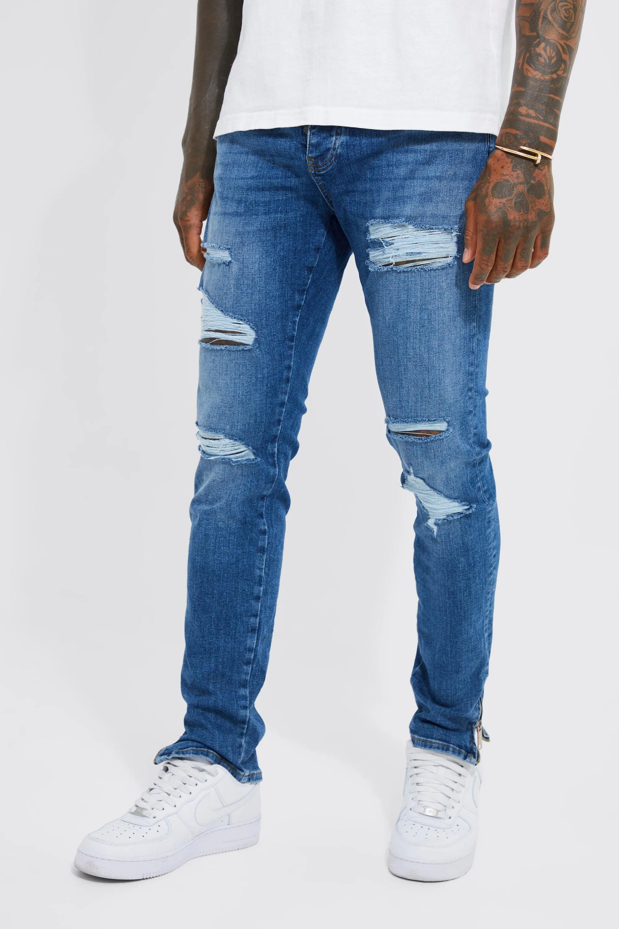 Skinny Stretch Ripped Jeans With Zip Hem